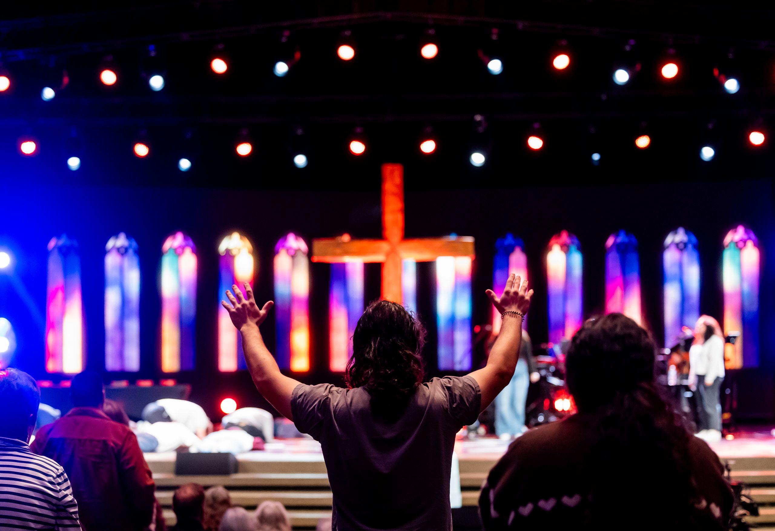 A church gathering with a speaker and musicians